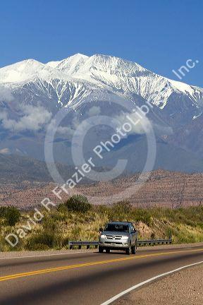 A view of the Andes Mountain Range with traffic on highway 7 near Mendoza, Argentina.