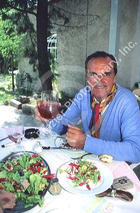 French man eating lunch in Paris, France.