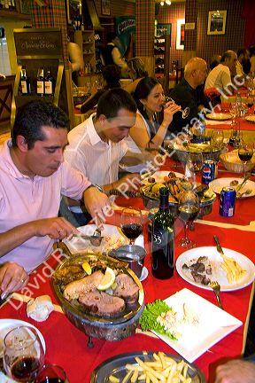 People dine in a restaurant at Ushuaia on the island of Tierra del Fuego, Argentina.