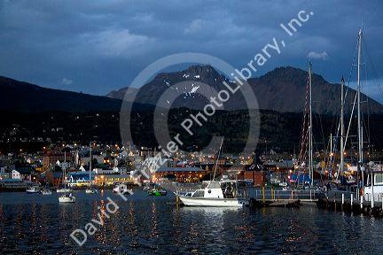 The harbor and city of Ushuaia at dusk on the island of Tierra del Fuego, Argentina.