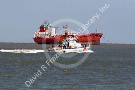 Oil tanker and U.S. Coast Guard patrol boat in Galveston Bay, Texas.