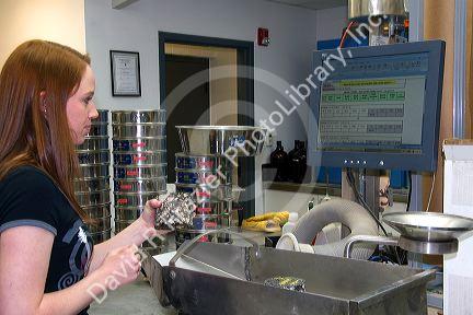 Technician working in a materials testing lab for the Ada County Highway District in Boise, Idaho.