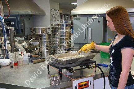 Technician working in a materials testing lab for the Ada County Highway District in Boise, Idaho.