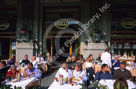 People dine outdoors at a restaurant in Florence, Tuscany, Italy.