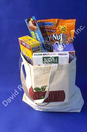 A canvas grocery bag with groceries.