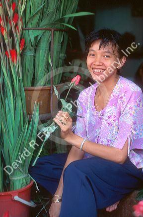 Flower vendor at Saigon market, Ho Chi Minh, Vietnam.