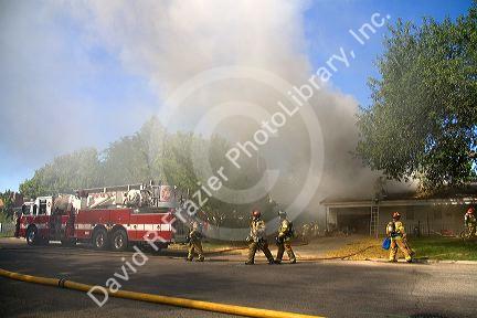Firefighters respond to a house fire in Boise, Idaho.