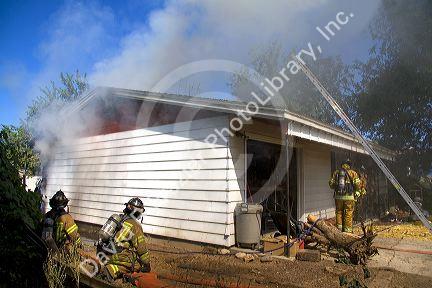 Firefighters respond to a house fire in Boise, Idaho.