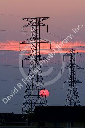 High voltage electric transmission lines at sunset in Boise, Idaho.