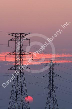 High voltage electric transmission lines at sunset in Boise, Idaho.