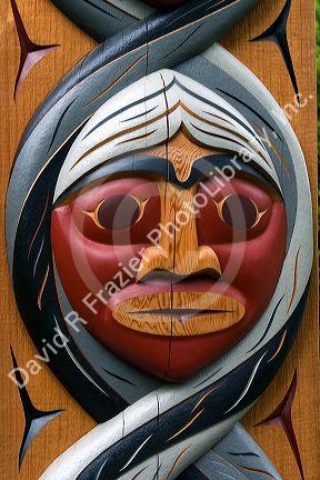 Carved face in a totem pole at Stanley Park in Vancouver, British Columbia, Canada.