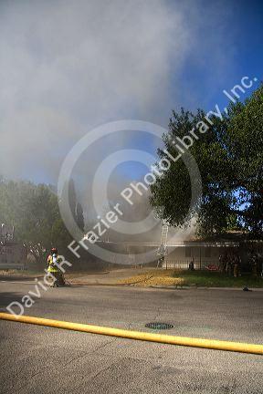 Firefighters respond to a house fire in Boise, Idaho.