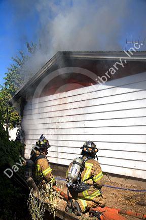 Firefighters respond to a house fire in Boise, Idaho.