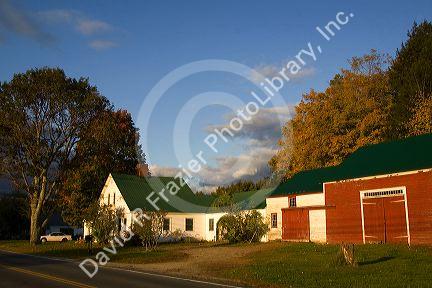 Red barn and residential home in the town of Wentworth, New Hampshire, USA.