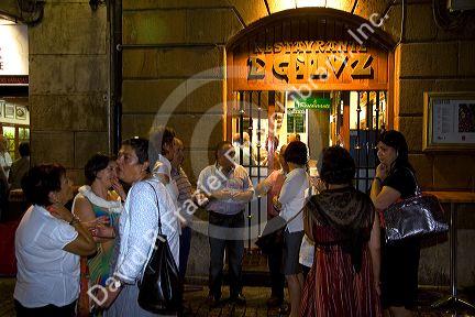 People socialize in front of a tavern in the city of Bilbao, Biscay, Basque Country, northern Spain.