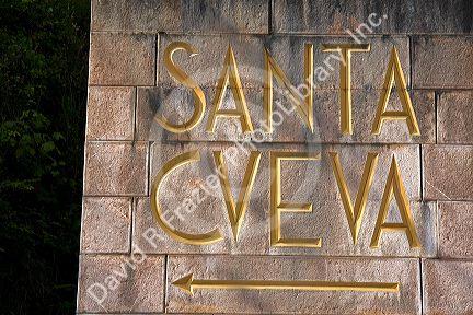 Sign directing you to the Holy Cave at Covadonga, Asturias, northwestern Spain.