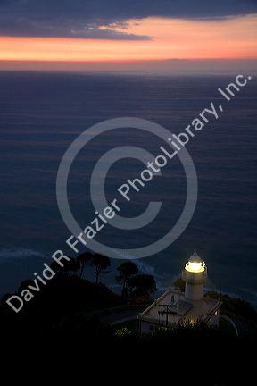 Monte Igueldo Lighthouse at sunset in La Concha Bay near the city of Donostia-San Sebastian, Guipuzcoa, Basque Country, Northern Spain.