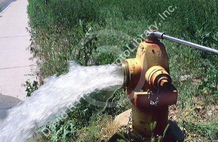 A fire hydrant being flushed.