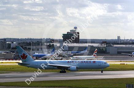 Air Canada airliner on the runway at London Heathrow Airport, England, United Kingdom.