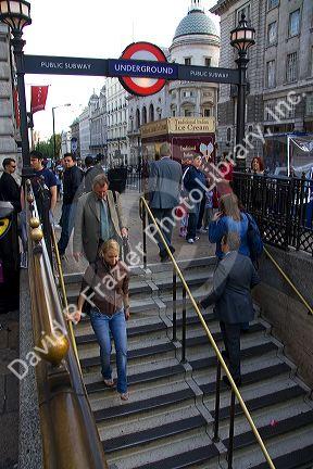 People entering and exiting the London Underground transit system in the city of London, England.