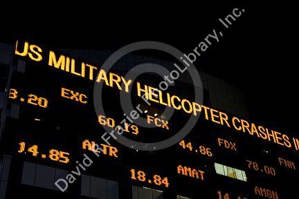 News and stock ticker in Times Square, Manhattan, New York City, New York, USA.