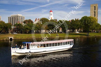 Tour boat on the Charles River and Harvard University in Cambridge, Greater Boston, Massachusetts, USA.