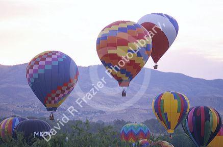 Hot air balloons floating over the city of Boise, Idaho.