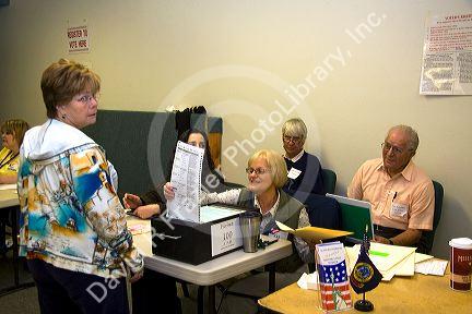 Paper ballot being put in the ballot box at a polling station in Boise, Idaho, USA.