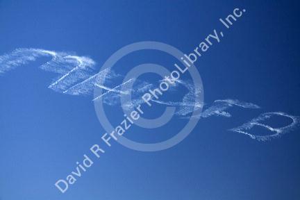 Small airplane sky writing over Boise, Idaho, USA.