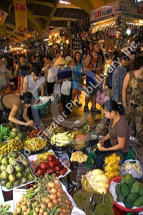 Vendors selling produce in the Ben Thanh Market located in Ho Chi Minh City, Vietnam.
