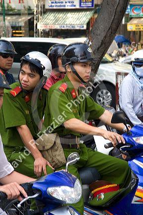 Vietnamese national soldiers ride a motorbike in Ho Chi Minh City, Vietnam.