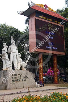 Monument to Vietnamese soldiers and a large digital clock counting down time until the Tet Lunar New Year in Hanoi, Vietnam.