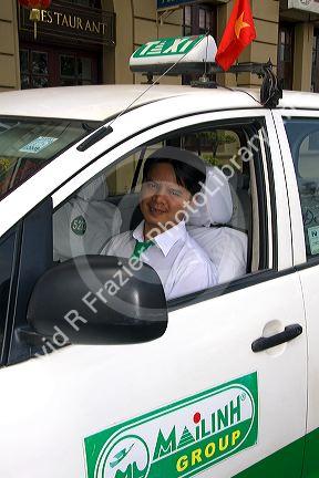 Vietnamese taxi cab driver in Ho Chi Minh City, Vietnam.