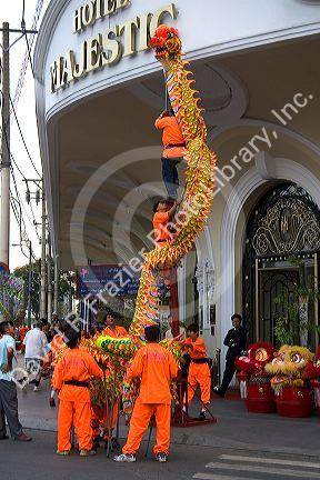 Vietnamese dragon dance in front of the Hotel Majestic during Tet Lunar New Year celebrations in Ho Chi Minh City, Vietnam.