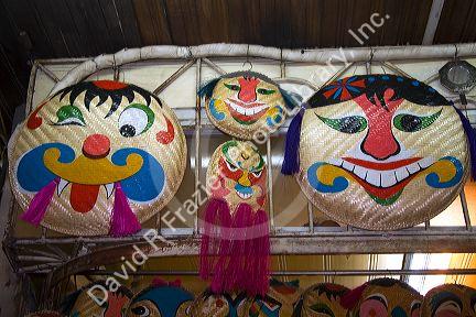 Painted ceremonial masks being sold for Tet in Hanoi, Vietnam.