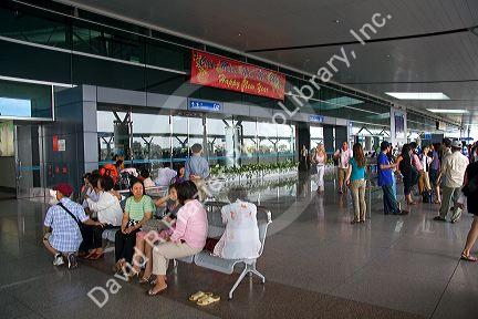 People waiting to greet passengers arriving at the Tan Son Nhat International Airport in Ho Chi Minh City, Vietnam.