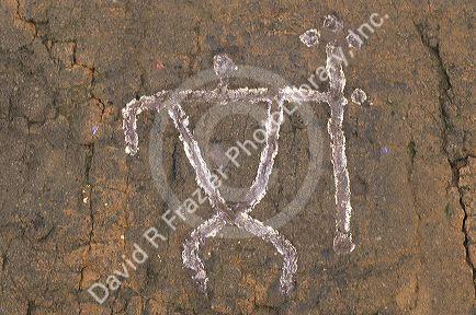 Petroglyph, an ancient drawing on the big island of Hawaii.