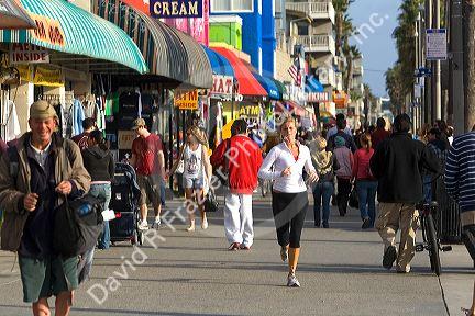 People and boardwalk retail space at Venice Beach, Los Angeles, California.
