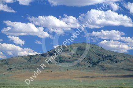 Cumulus clouds over Malheur County, Oregon high desert mountains.