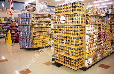 End cap displays at the end of the aisle in a grocery store.