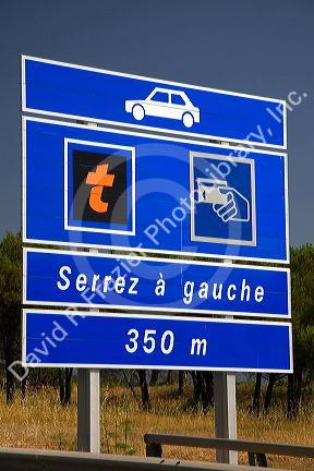 French language road sign warning of toll station ahead on the A8 autoroute, La Provencale, in Southern France.