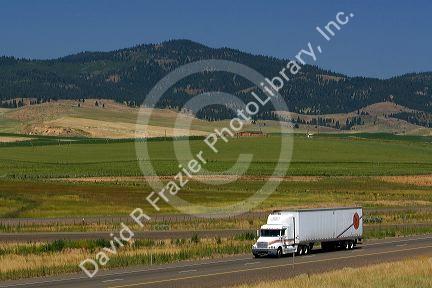 Truck transporting freight along Interstate 84 near North Powder, Oregon, USA.