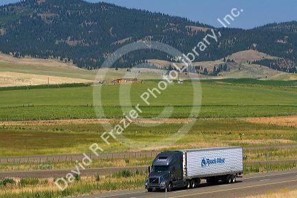 Truck transporting freight along Interstate 84 near North Powder, Oregon, USA.