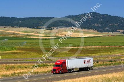 Truck transporting freight along Interstate 84 near North Powder, Oregon, USA.