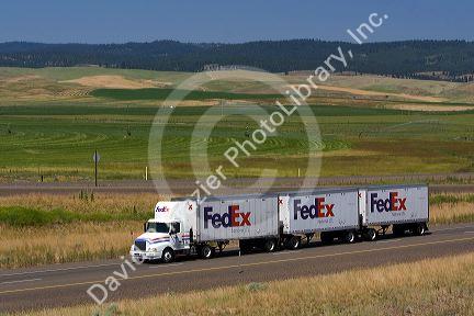 Truck transporting freight along Interstate 84 near North Powder, Oregon, USA.