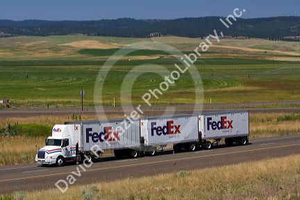 Truck transporting freight along Interstate 84 near North Powder, Oregon, USA.