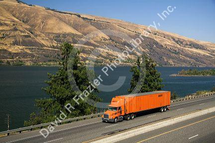 Truck transporting freight through the Columbia River Gorge near Hood River, Oregon, USA.