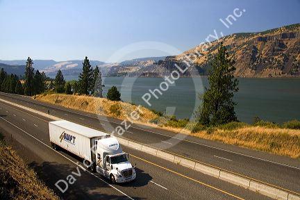 Truck transporting freight through the Columbia River Gorge near Hood River, Oregon, USA.