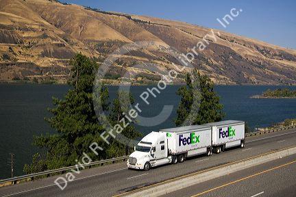 Truck transporting freight through the Columbia River Gorge near Hood River, Oregon, USA.