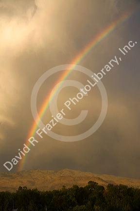 Rainbow over the foothills and city of Boise, Idaho, USA.